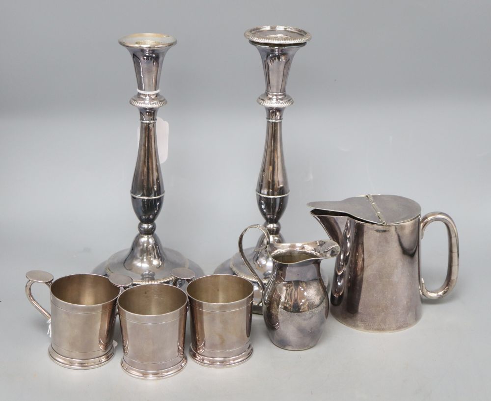 A pair of plated candlesticks and sundries